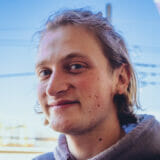 Dzavid Dennhardt smiles at the camera